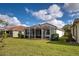 House with a large backyard and screened patio at 19279 Jacinda St, Venice, FL 34293