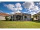 Home with a large backyard and screened patio at 19279 Jacinda St, Venice, FL 34293