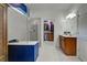 Bathroom with walk-in shower, double vanity, and large closet at 19279 Jacinda St, Venice, FL 34293