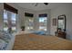 Spacious bedroom with large windows, a comfortable bed, and ample natural light at 19279 Jacinda St, Venice, FL 34293