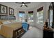 Bright bedroom with large windows, ceiling fan, and a comfortable bed at 19279 Jacinda St, Venice, FL 34293