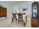 Bright dining room with wooden table and sideboard at 19279 Jacinda St, Venice, FL 34293
