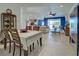 Open concept dining room with views into living room at 19279 Jacinda St, Venice, FL 34293