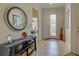 Bright and airy entryway with tile floors and a decorative console table at 19279 Jacinda St, Venice, FL 34293
