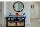 Elegant entryway features a console table and mirror at 19279 Jacinda St, Venice, FL 34293