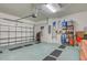 Organized garage with overhead storage and floor mats at 19279 Jacinda St, Venice, FL 34293
