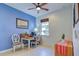 Charming home office with blue walls, window, and workspace at 19279 Jacinda St, Venice, FL 34293