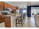 Spacious kitchen boasts granite counters and island with seating at 19279 Jacinda St, Venice, FL 34293