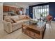 Bright and airy living room with comfortable seating and large windows at 19279 Jacinda St, Venice, FL 34293