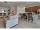 Open living room with view of kitchen and dining area at 19279 Jacinda St, Venice, FL 34293
