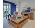 Relaxing living room featuring comfortable seating and a large TV at 19279 Jacinda St, Venice, FL 34293