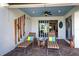 Outdoor patio with lounge chairs and wood accents at 19279 Jacinda St, Venice, FL 34293