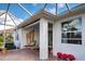 Enjoy the view from this screened patio with lounge chairs at 19279 Jacinda St, Venice, FL 34293