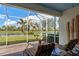 Relaxing screened patio overlooking a lake at 19279 Jacinda St, Venice, FL 34293