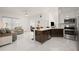 Modern kitchen with stainless steel appliances and an island at 200 Gardens Edge Dr # 223, Venice, FL 34285