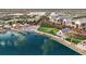 Aerial view of a waterfront community with shops, green spaces, and a pier at 20100 Ragazza Cir # 101, Venice, FL 34293