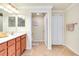 Bathroom with dual vanity, water closet, and tile flooring at 20100 Ragazza Cir # 101, Venice, FL 34293