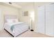 Bedroom with white bed and closet, carpeted flooring at 20100 Ragazza Cir # 101, Venice, FL 34293