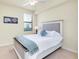Cozy bedroom with carpeted flooring and a window with blinds at 20100 Ragazza Cir # 101, Venice, FL 34293