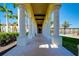 Covered walkway with columns leading to the community clubhouse at 20100 Ragazza Cir # 101, Venice, FL 34293