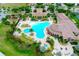 Aerial view of the community pool, clubhouse, and playground at 20100 Ragazza Cir # 101, Venice, FL 34293