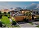 Attractive two-story townhome with tile roof, paver driveway, and attached two-car garage at 20100 Ragazza Cir # 101, Venice, FL 34293