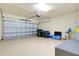 Garage interior with storage bins and an automatic door opener at 20100 Ragazza Cir # 101, Venice, FL 34293