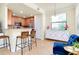 Inviting kitchen with granite countertops, stainless steel appliances, and breakfast bar at 20100 Ragazza Cir # 101, Venice, FL 34293
