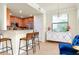 Stylish kitchen with stainless steel appliances, granite countertops, and a breakfast bar at 20100 Ragazza Cir # 101, Venice, FL 34293
