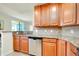 Sleek kitchen with stainless steel appliances and granite countertops at 20100 Ragazza Cir # 101, Venice, FL 34293