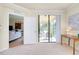 Living area with sliding glass doors that open to a screened-in patio at 20100 Ragazza Cir # 101, Venice, FL 34293