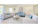 Comfortable living room with stylish furniture, a unique coffee table, and a cozy rug at 20100 Ragazza Cir # 101, Venice, FL 34293