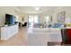 Inviting living room with comfortable seating, stylish decor, and access to a patio at 20100 Ragazza Cir # 101, Venice, FL 34293