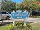 Centennial Park sign in a parking area with trees and landscaping at 20100 Ragazza Cir # 101, Venice, FL 34293