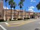 Venice Theatre building with palm trees and a crosswalk at 20100 Ragazza Cir # 101, Venice, FL 34293