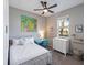 Bright bedroom with a comfortable bed, desk, and ample storage at 2049 Mesic Hammock Way, Venice, FL 34292