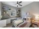 Bedroom with built-in desk, window seat, and full-size bed at 2049 Mesic Hammock Way, Venice, FL 34292