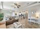 Open living room and kitchen with tile floors at 2049 Mesic Hammock Way, Venice, FL 34292