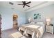 Spacious main bedroom with ensuite bathroom and ceiling fan at 2049 Mesic Hammock Way, Venice, FL 34292