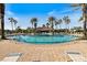 Resort-style community pool with surrounding lounge chairs at 2049 Mesic Hammock Way, Venice, FL 34292