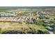 An aerial view of a golf course community with a circled property alongside the golf course at 209 Martellago Dr, North Venice, FL 34275