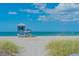 Lifeguard stand on a sandy beach with calm ocean waters at 209 Martellago Dr, North Venice, FL 34275