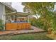 Hot tub with wooden enclosure, bar stools, and patio at 2420 Butternut Ct, Dunedin, FL 34698