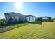 Sprawling backyard with well-maintained lawn, screened in lanai and pool at 26069 Norman Dr, Englewood, FL 34223