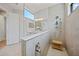 Contemporary bathroom showcasing a walk-in shower with a glass partition and stylish fixtures at 26069 Norman Dr, Englewood, FL 34223