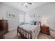 Cozy bedroom featuring charming nautical-themed decor and hardwood flooring at 26069 Norman Dr, Englewood, FL 34223