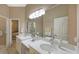 Double vanity bathroom with white quartz countertop and plenty of storage at 275 Royal Oak Way, Venice, FL 34292