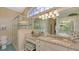 Bathroom features a large walk-in shower, granite vanity, and tile flooring at 275 Royal Oak Way, Venice, FL 34292