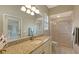 Bathroom with granite vanity, shower, and updated fixtures at 275 Royal Oak Way, Venice, FL 34292