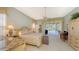 Spacious bedroom with king-size bed, access to patio, and built-in desk at 275 Royal Oak Way, Venice, FL 34292